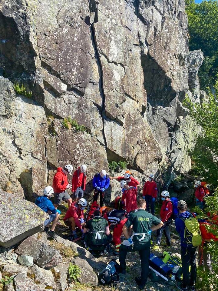 Mountain rescuers and ambulance staff attend to a climber after he fell 26ft from a cliff face (Keswick Mountain Rescue Team)