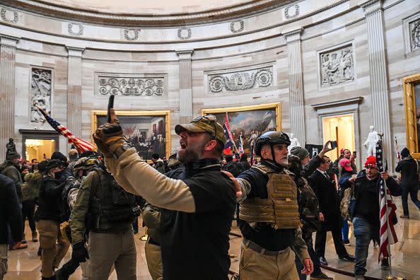 Supporters of US President Donald Trump enter the US Capitol's Rotunda on January 6, 2021, in Washington, DC. - Demonstrators breeched security and entered the Capitol as Congress debated the a 2020 presidential election Electoral Vote Certification. (Photo by Saul LOEB / AFP) (Photo by SAUL LOEB/AFP via Getty Images)