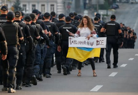 An anti-LGBT protester is seen before an equality March, organized by the LGBT community in Kiev