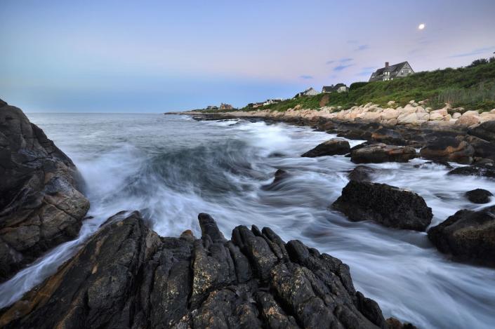 <p>Rocks surround Narragansett Bay, located on the north side of Rhode Island. Tourists visit the seaside town for its warm-water beaches.</p>