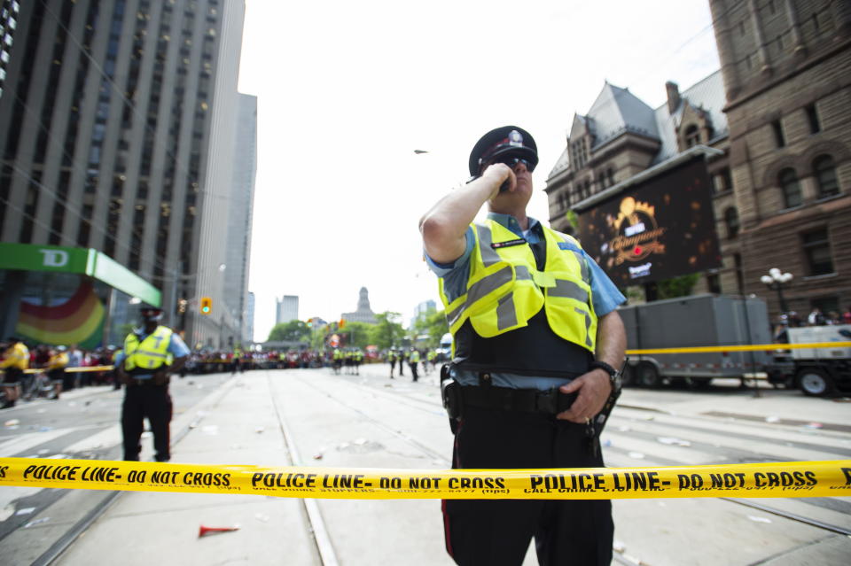 Toronto Police secure the scene after a shots were fired during the Toronto Raptors NBA basketball championship parade in Toronto, Monday, June 17, 2019. (Andrew Lahodynskyj/The Canadian Press via AP)