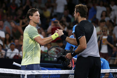 Tennis - Australian Open - Hisense Arena, Melbourne, Australia, January 20, 2018. Czech Republic's Tomas Berdych shakes hands with Argentina's Juan Martin del Potro after winning their match. REUTERS/Toru Hanai