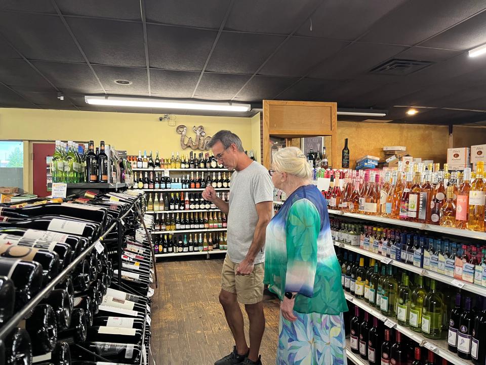 Local wine sommelier Katherine Palmer checks out the wines at Bartlesville Wines and Spirits.