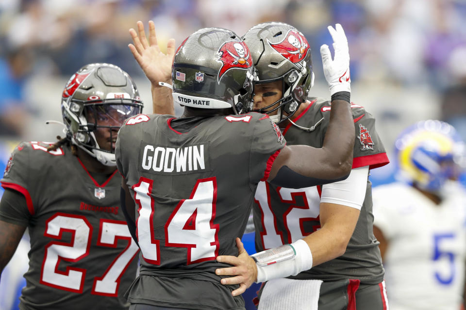 INGLEWOOD, CA - SEPTEMBER 26: Tampa Bay Buccaneers wide receiver Chris Godwin (14) celebrates with Tampa Bay Buccaneers quarterback Tom Brady (12) after a touchdown during a game between the Tampa Bay Buccaneers and the Los Angeles Rams at SoFi Stadium on September 26, 2021 in Inglewood, California. (Photo by Jordon Kelly/Icon Sportswire via Getty Images)