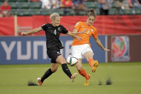 Jun 6, 2015; Edmonton, Alberta, CAN; Netherlands midfielder Tessel Middag (17) shoots against New Zealand midfielder Katie Duncan (4) during the second half of a Group A soccer match in the 2015 women's World Cup at Commonwealth Stadium. Erich Schlegel-USA TODAY Sports