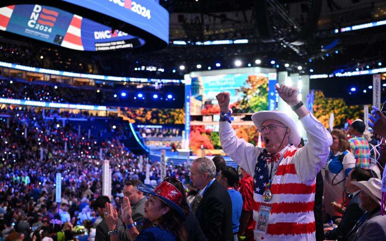 Delegates cheer during the ceremonial roll call vote on the second day of the Democratic National Convention