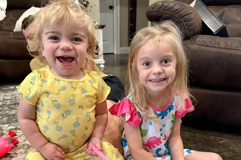 Lydia (left) pictured with big sister Heidi, aged 5.