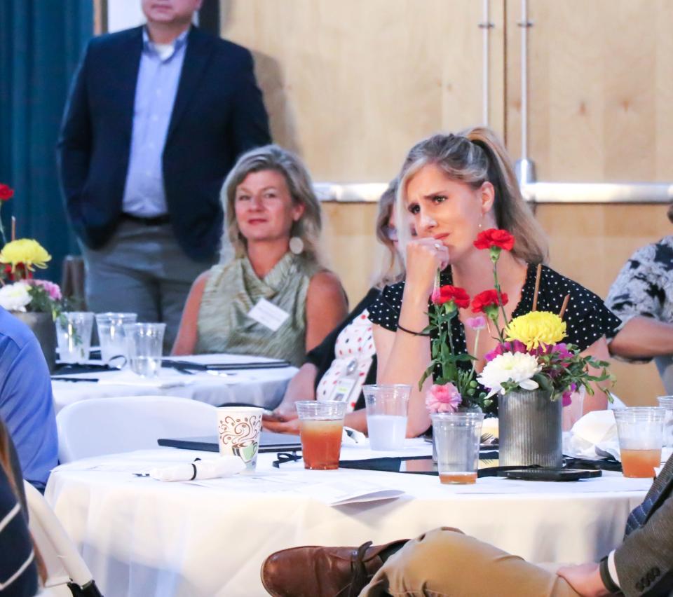 West Henderson High teacher Kelly Stepp gets emotional during the luncheon on May 9 where she was named the 2024 Henderson County Public Schools Teacher of the Year.