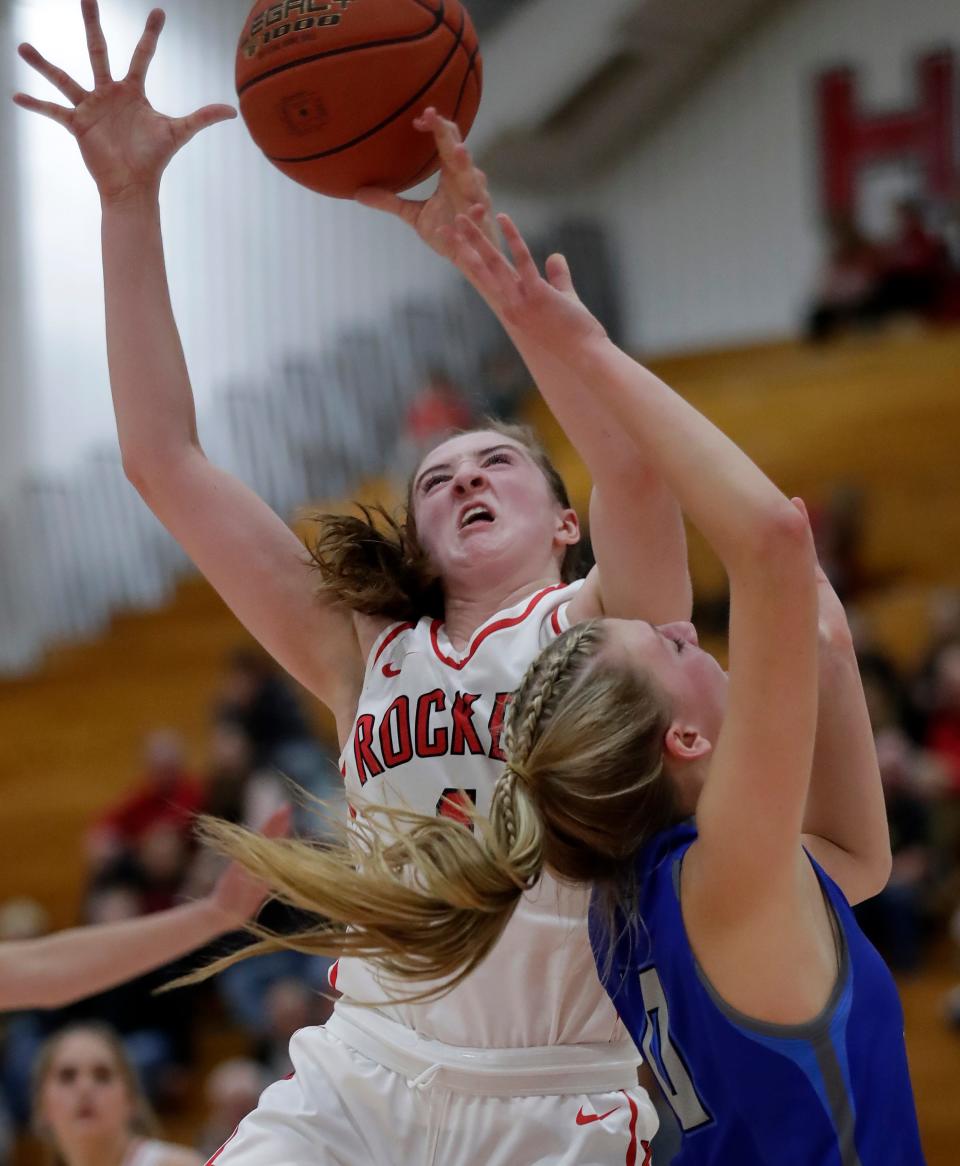Neenah's Allie Ziebell (top), pictured in a game against Green Bay Southwest, has helped the Rockets claim a share of the Fox Valley Association title. Ziebell scored 36 points in the Rockets' 67-47 victory over Hortonville on Friday.
