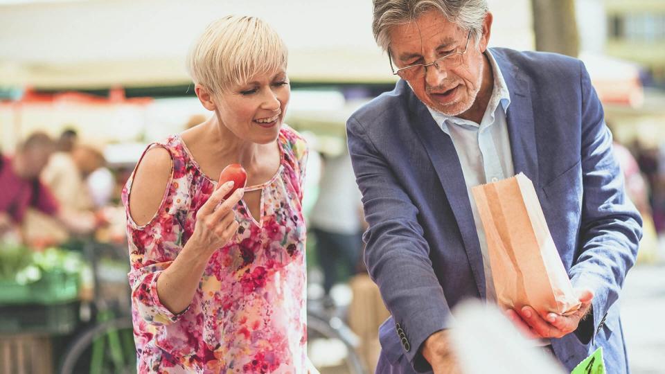 older couple shopping at a farmer's market