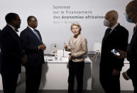 European Commission President Ursula von der Leyen, center, speaks with the president of the African Development Bank Akinwumi Adesina, left, Senegal's President Macky Sall and Tunisia's President Kais Saied, second right, before the opening session at the Summit on the Financing of African Economies Tuesday, May 18, 2021 in Paris. More than twenty heads of state and government from Africa are holding talks in Paris with heads of international organizations on how to revive the economy of the continent, deeply impacted by the consequences of the COVID-19 pandemic. (Photo by Ludovic Marin, Pool via AP)