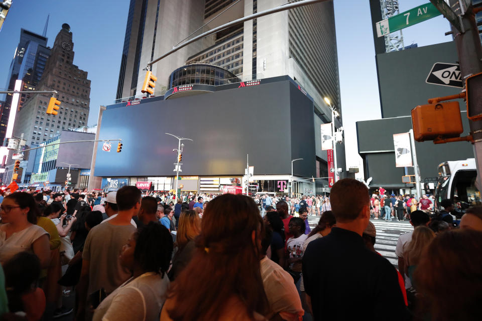 Screens in Times Square are black during a widespread power outage, Saturday, July 13, 2019, in the Manhattan borough of New York. Authorities say a transformer fire caused a power outage in Manhattan and left businesses without electricity, elevators stuck and subway cars stalled. (Photo: Michael Owens/AP)