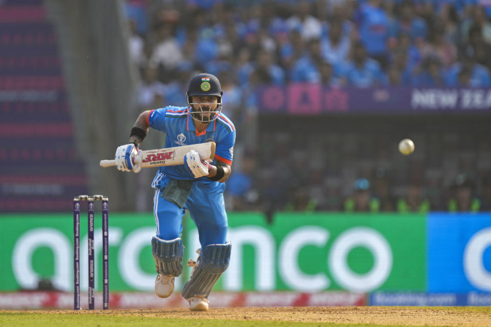 India's Virat Kohli runs after playing a shot during the ICC Men's Cricket World Cup first semifinal match between India and New Zealand in Mumbai, India, Wednesday, Nov. 15, 2023. (AP Photo/Rajanish Kakade)