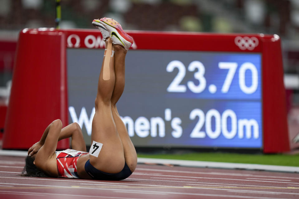 Katarina Johnson-Thompson, of Britain, reacts after falling during a heat in the heptathlon women's 200-meter at the 2020 Summer Olympics, Wednesday, Aug. 4, 2021, in Tokyo. (AP Photo/Martin Meissner)