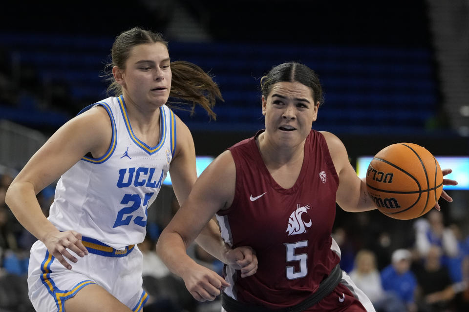 Washington State guard Charlisse Leger-Walker, right, dribbles against UCLA forward Gabriela Jaquez, left, during the first half of an NCAA college basketball game, Sunday, Jan. 28, 2024, in Los Angeles. (AP Photo/Ryan Sun)