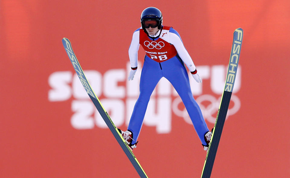 Austria's Daniela Iraschko-Stolz soars through the air during a women's ski jumping training session at the 2014 Winter Olympics, Saturday, Feb. 8, 2014, in Krasnaya Polyana, Russia. (AP Photo/Matthias Schrader)