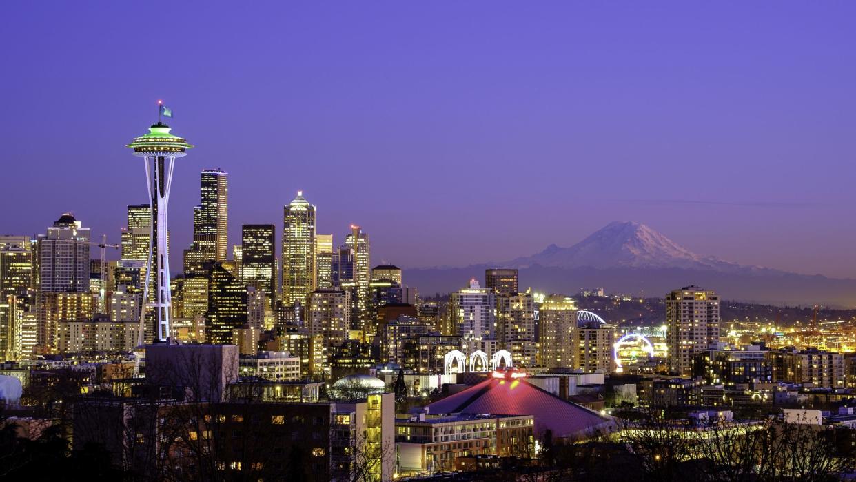 A scenic view of the Space Needle in Seattle, WA and the Mt. Rainier is visible in the background. This picture taken from Kerry Park, Queen Anne area on January 29, 2015 at 17:50.