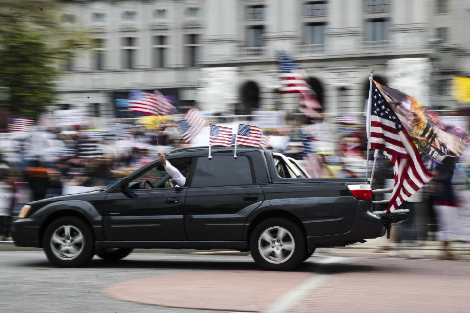 Protesters demonstrate at the state Capitol in Harrisburg, Pa., Monday, April 20, 2020, demanding that Gov. Tom Wolf reopen Pennsylvania's economy even as new social-distancing mandates took effect at stores and other commercial buildings. (AP Photo/Matt Rourke)