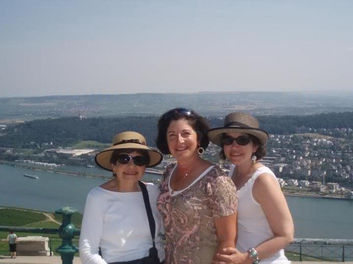 This 2012 photo provided by Anne D’Innocenzio shows her on the right with her sister Donna in the middle and mother Marie on the left in Rudesheim, Germany, on a port call they made while taking a Rhine River cruise together. D’Innocenzio grew up taking family trips with her parents and siblings, and continues to enjoy vacationing with her mother, even though their travel styles sometimes differ and their roles have reversed a bit, with D’Innocenzio doing more of the caretaking for her aging parent. (AP Photo)