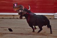 <p>A ‘Banderillo’ assistant bullfighter is gored by a bull from the Puerto de San Lorenzo ranch during a bullfight at the San Fermin Fiestas in Pamplona, Spain, July 9, 2017. (AP Photo/Alvaro Barrientos) </p>