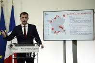 French Health Minister Olivier Veran speaks during a press conference in Paris, Wednesday Sept. 23, 2020. French Health Minister Olivier Veran announced the closure of all restaurants and bars in the Marseille region and restrictions across a dozen other cities to stem the resurgent spread of the virus. With COVID-19 patients now occupying more than 10% of France's intensive care beds, Veran stopped short of imposing new lockdowns, but urged people to resume working from home and stop gathering with big groups of family and friends.(Eliot Blondet/Pool via AP)