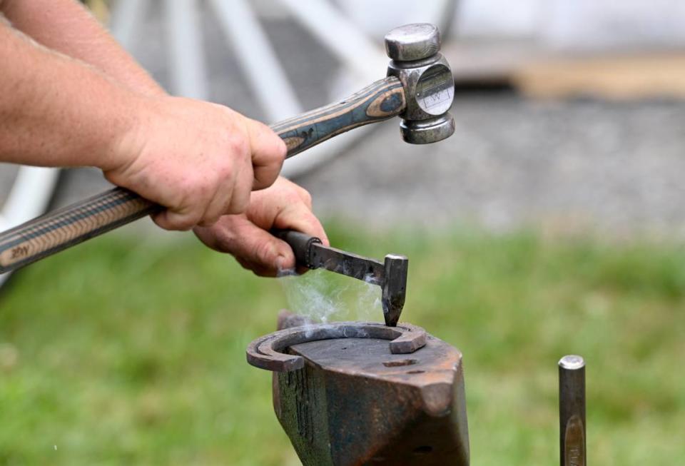 Colton Specht demonstrates handmade horseshoes at Penn State’s Ag Progress Days on Tuesday, Aug. 9, 2022.