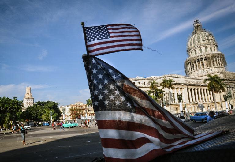 US flags are seen near the capitol in Havana, Cuba, on January 23, 2015