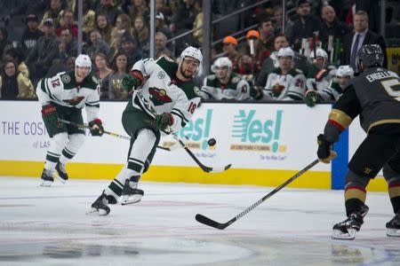 Jan 21, 2019; Las Vegas, NV, USA; Minnesota Wild left wing Jordan Greenway (18) passes the puck during his game against the Vegas Golden Knights in Las Vegas at T-Mobile Arena. Mandatory Credit: Daniel Clark-USA TODAY Sports