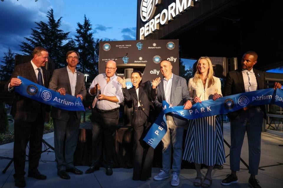 Team Owner David Tepper, third from the left, cuts the ribbon at Charlotte FC’s grand opening of their state of the art training facility, Atrium Health Performance Park, on Tuesday, October 10, 2023 in Charlotte, NC.