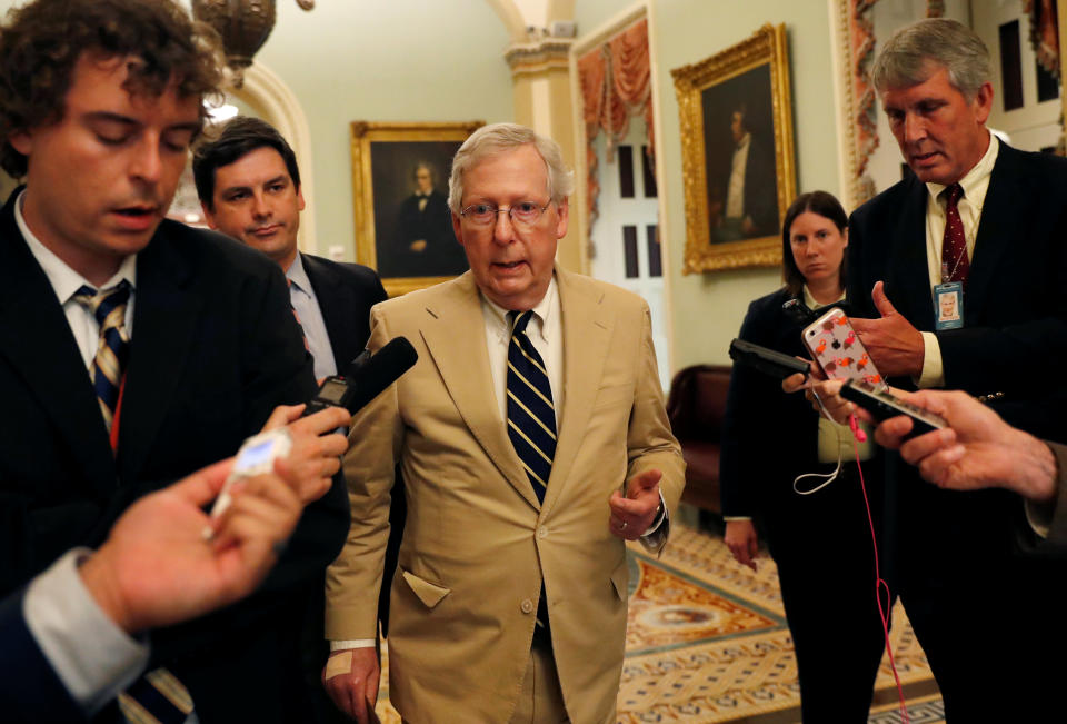 Senate Majority Leader Mitch McConnell speaks with news media as he walks through the U.S. Capitol building in Washington, U.S., July 16, 2018. REUTERS/Leah Millis