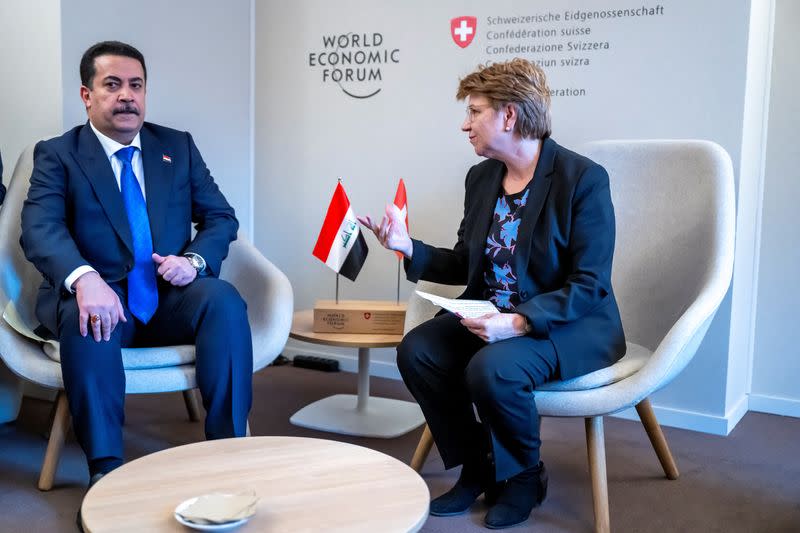 Iraq's Prime Minister Mohammed Shia al-Sudani, speaks with President of the Swiss Confederation Viola Amherd in Davos