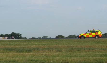 A special bird-scaring 4x4 vehicle chases after the flamingo on Manchester Airport's second runway