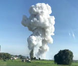 <p>Smoke rises after fireworks blast in Tultepec, outside Mexico City, Mexico July 5, 2018 in this picture grab obtained from social media video. (Photo: David Villanueva via Reuters) </p>