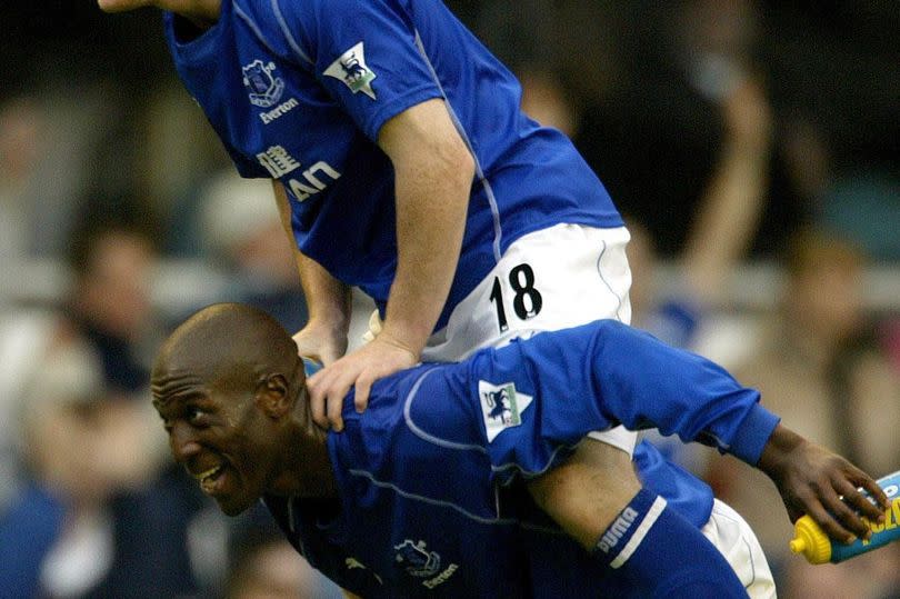 Kevin Campbell with former team mate Wayne Rooney -Credit:PA