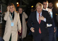 Britain's Prime Minister and Conservative Party leader Boris Johnson and his partner Carrie Symonds arrives for the Uxbridge and South Ruislip constituency count declaration at Brunel University in Uxbridge, London, Friday, Dec. 13, 2019. (AP Photo/Kirsty Wigglesworth)