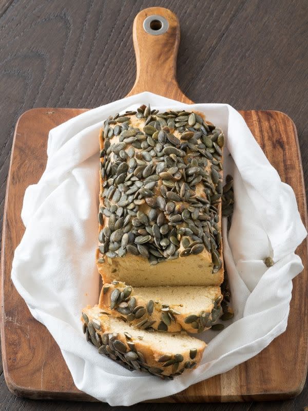 <p>Instead of traditional dinner rolls for the holiday, enjoy a slice of this keto-approved pumpkin bread from <a href="https://ketogasm.com/keto-bread-with-pumpkin-seeds-recipe/" rel="nofollow noopener" target="_blank" data-ylk="slk:Ketogasm;elm:context_link;itc:0;sec:content-canvas" class="link ">Ketogasm</a>. Each slice has 257 calories, but it’s also gluten-free and packed with healthy fats from the pumpkin seeds. And there are only 3 net grams of carbs a slice.</p>