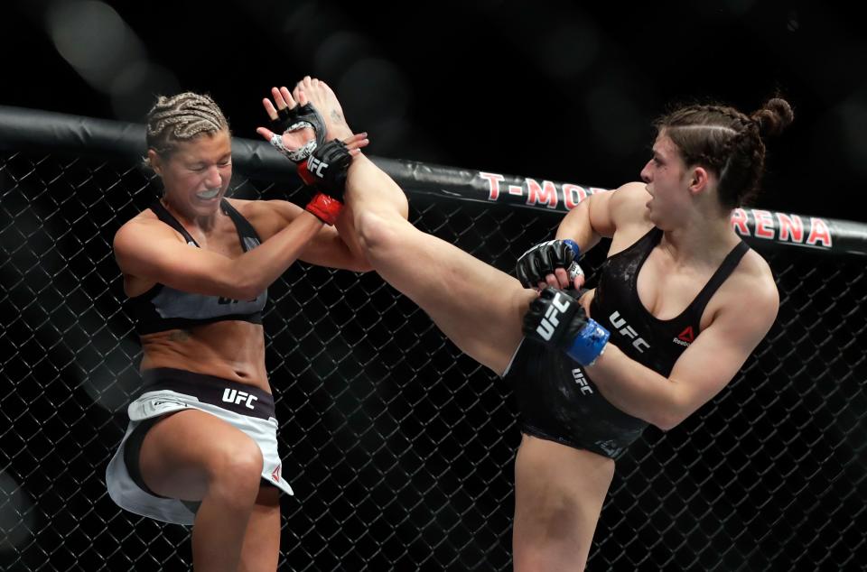 Ashley Yoder (L) blocks a kick from Mackenzie Dern during their women’s strawweight bout during UFC 222 at T-Mobile Arena on March 3, 2018 in Las Vegas, Nevada. (Getty Images)