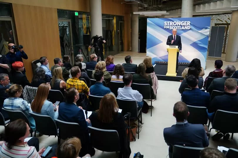 Newly elected leader of the Scottish National Party (SNP) John Swinney delivers his acceptance speech at Glasgow University