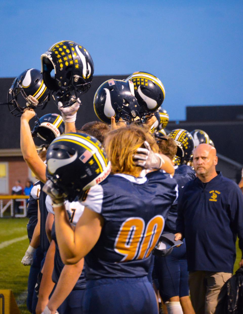 River Valley's sideline gets excited during a football game last year at home.