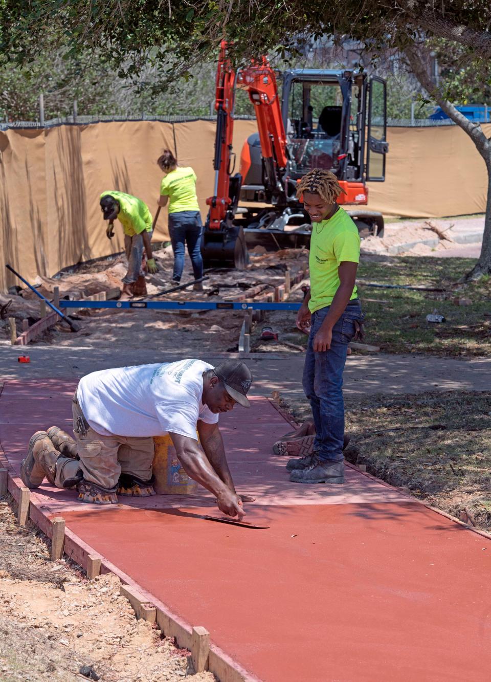 Nearly two years after Hurricane Sally ravaged Plaza De Luna, contract workers from Emerald Coast Contractors, Inc. are working to repair the tropical cyclone's damage to the downtown Pensacola park on April 28, 2022. 