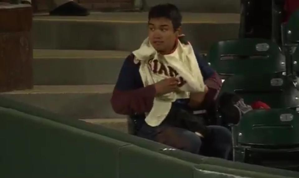 This fan of the Giants or the Diamondbacks kept switching jerseys every half inning to increase his chances of getting a souvenir baseball. (Twitter/@FOXSPORTSAZ)