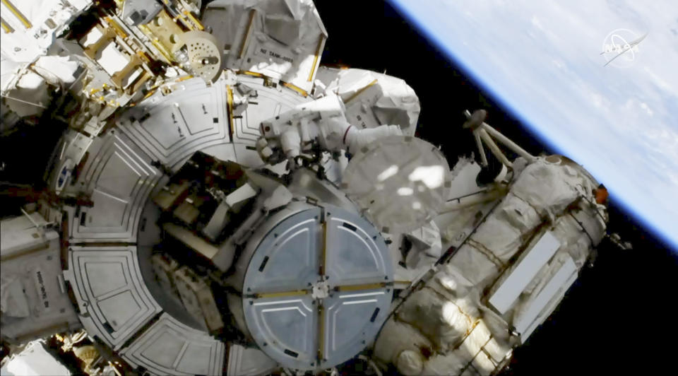 This image provided by NASA shows astronauts Andrew Morgan on a spacewalk outside the International Space Station on Friday, Oct. 11, 2019. Morgan and Christina Koch are replacing decade-old batteries in the station’s solar power network with new and improved lithium-ion versions. It’s the second of five spacewalks planned this month to install six new batteries that arrived via a Japanese supply ship two weeks ago (NASA via AP)