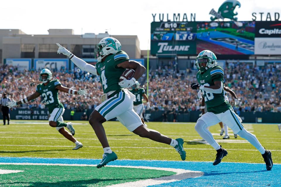 Tulane wide receiver Jha'Quan Jackson (4) returns a kickoff to score a touchdown during the first half an NCAA college football against Memphis in New Orleans, Saturday, Oct. 22, 2022. (AP Photo/Tyler Kaufman)