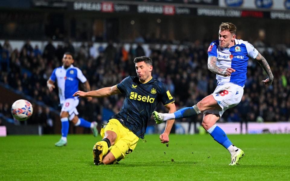 Sammie Szmodics of Blackburn Rovers shoots whilst under pressure from Fabian Schar