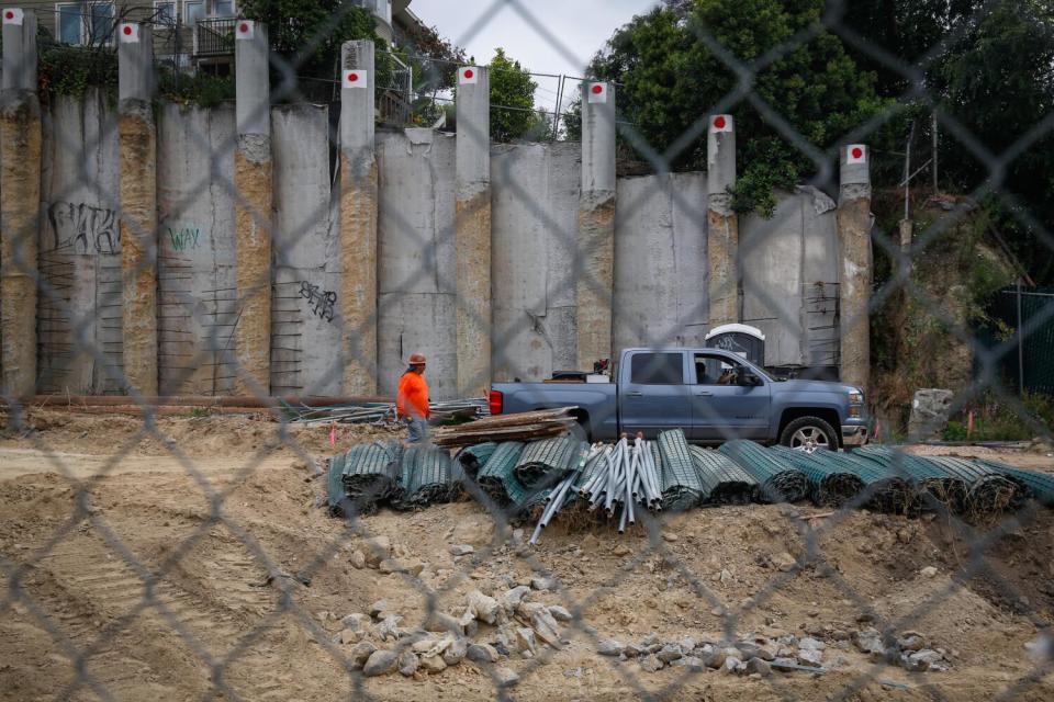 A construction worker works on a project at a property in Eagle Rock