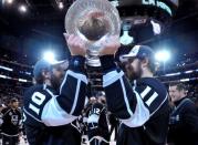 Jun 13, 2014; Los Angeles, CA, USA; Los Angeles Kings center Mike Richards (10) and center Anze Kopitar (11) hoist the Stanley Cup after defeating the New York Rangers game five of the 2014 Stanley Cup Final at Staples Center. Mandatory Credit: Gary A. Vasquez-USA TODAY Sports