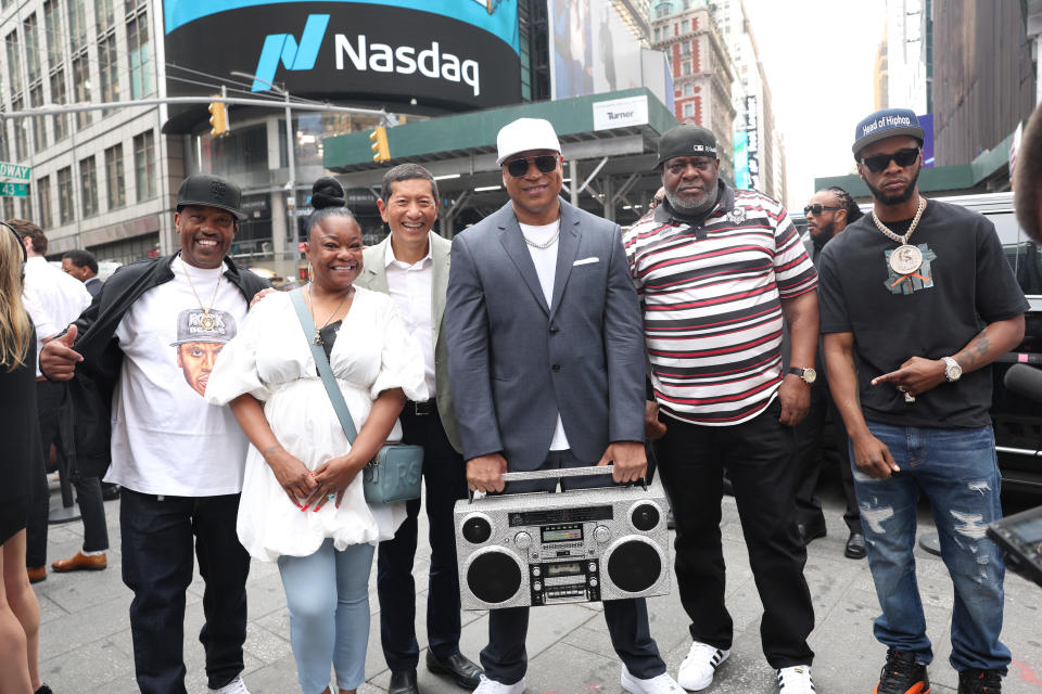 From left: DJ Cool V, Roxanne Shante, Geoff Yang, LL Cool J, DJ Chuck Chillout and Papoose outside NASDAQ after ringing the opening bell on August 3. (Johnny Nunez/WireImage)