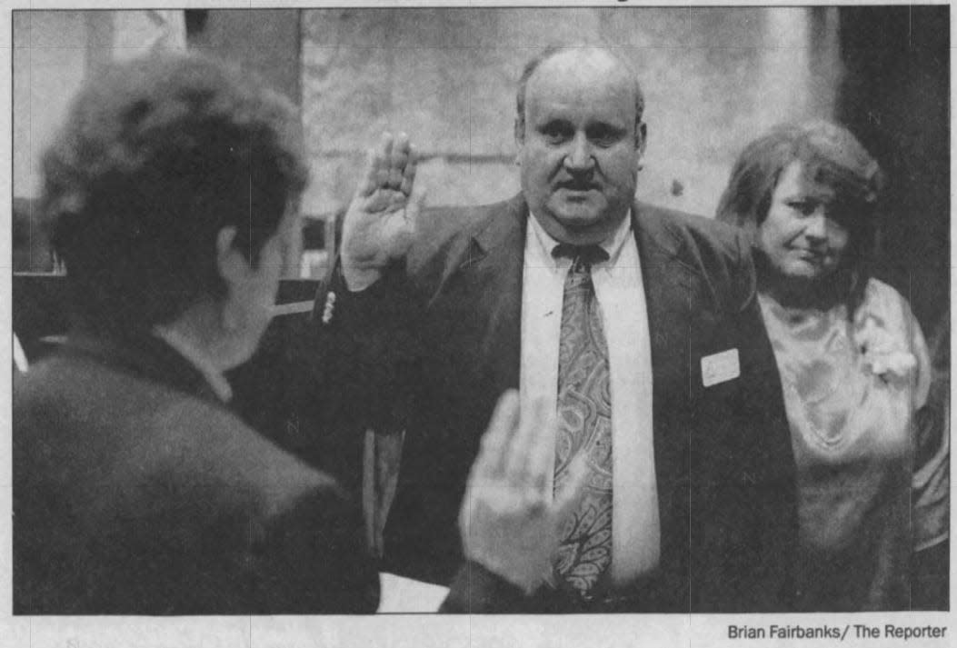 Allen Buechel took his first official oath of office April 21, 1993, and his sister Joyce Buechel, then-county clerk, administered the oath. His wife Betty, far right, was beside him.