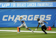 Los Angeles Chargers wide receiver Jalen Guyton (15) scores past Jacksonville Jaguars cornerback Brandon Watson (40) during the second half of an NFL football game Sunday, Oct. 25, 2020, in Inglewood, Calif. (AP Photo/Alex Gallardo )