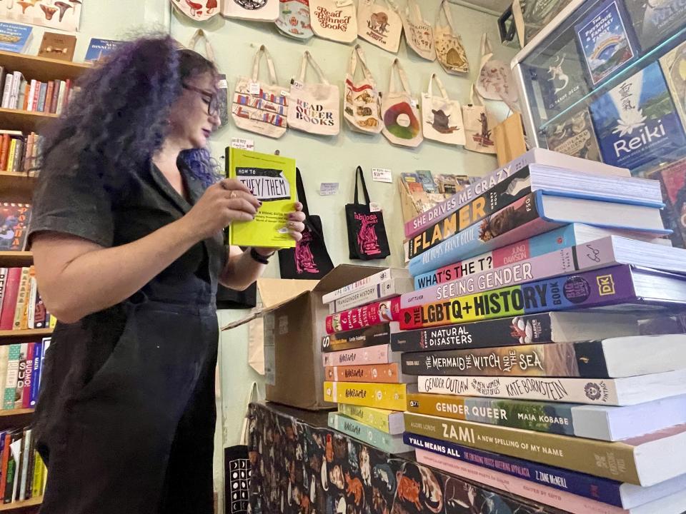 Becka Robbins, Events Manager, and founder of the "Books Not Bans" program at Fabulosa Books packs up LGBTQ+ books to be sent to parts of the country where they are censored on Thursday, June 27, 2024, at the Castro District of San Francisco. The bookstore is sending LGBTQ+ books to where they are censored to counter the rapidly growing effort by anti-LGBTQ+ activists and lawmakers to ban queer-friendly books from public schools and libraries. (AP Photo/Haven Daley)